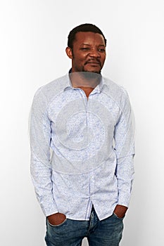 Unhappy african american black man in casual bright shirt with small beard isolated white background