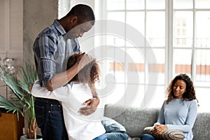 Unhappy African American family in living room divorce concept