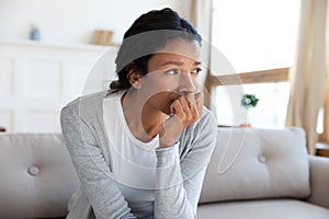 Unhappy African American woman feel lonely at home