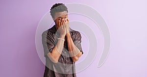 unhappy African young man crying having problems