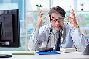 The unhappy angry call center worker frustrated with workload