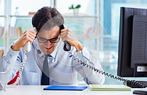 Unhappy angry call center worker frustrated with workload