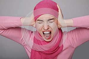 Unhappy arab woman in hijab close-up, pessimistic mood, sorrow, stress.