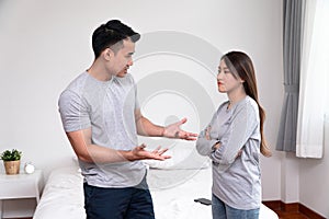 Unhappy Asian Couples standing beside each other and women avoid talking or quarrel, Cause of angry, quarrel, relationship