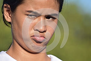 An Unhappy Beautiful Philippine Youth Closeup