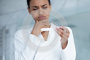 Unhappy biracial woman do ovulation pregnancy test
