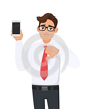 Unhappy business man showing new brand, latest smartphone. Man holding cell, mobile phone in hand and making thumbs down.