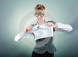 Unhappy business woman showing crumpled contract