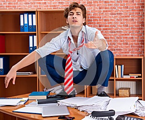 Unhappy businessman sitting in the office