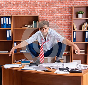 Unhappy businessman sitting in the office