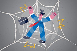 Unhappy businessman trapped in spider web network