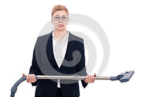 Unhappy businesswoman with vacuum cleaner