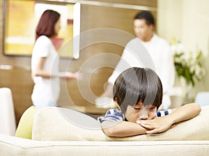 Unhappy child and quarreling parents