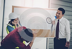 Unhappy Construction team Boss shouting aggressively to his employer in team meeting