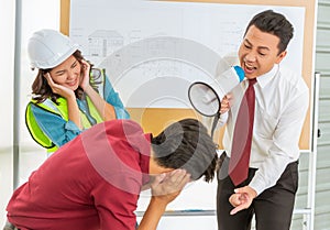 Unhappy Construction team Boss shouting aggressively to his employer in team meeting