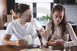 Unhappy couple arguing having disagreement at psychologists office, frustrated young family discussing relationship problems