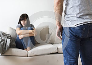 Unhappy couple arguing on the sofa photo