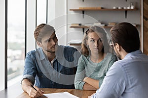 Unhappy couple buyer frustrated at meeting with realtor