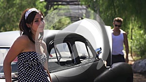 Unhappy couple in conflict with broken car