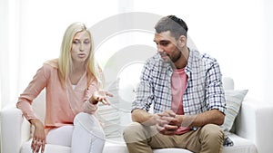 Unhappy couple having argument at home