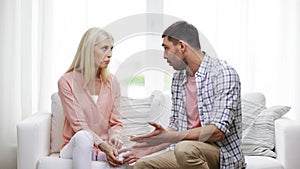 Unhappy couple having argument at home