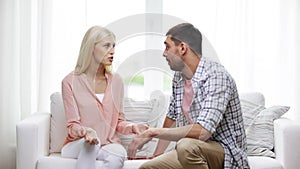 Unhappy couple having argument at home