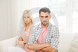 Unhappy couple having argument at home