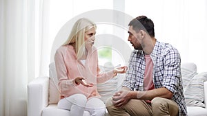 Unhappy couple having argument at home