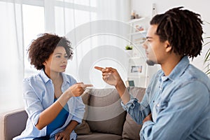 Unhappy couple having argument at home