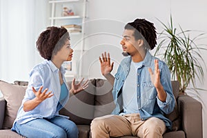 Unhappy couple having argument at home