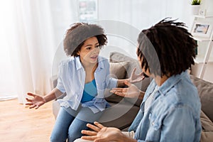 Unhappy couple having argument at home