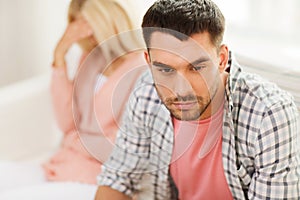 Unhappy couple having argument at home photo