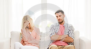 Unhappy couple having argument at home photo