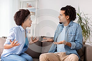 Unhappy couple having argument at home photo