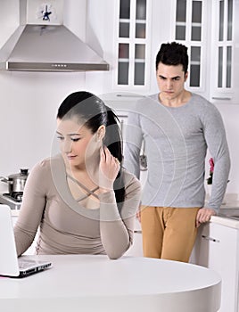 Unhappy couple in the kitchen