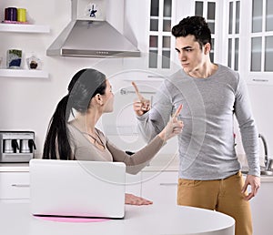 Unhappy couple in the kitchen photo