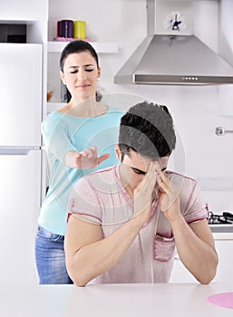 Unhappy couple red vine in the kitchen