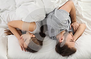 Unhappy couple with relationship problems after quarrel in bed