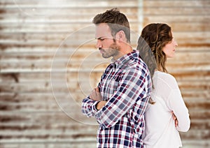 Unhappy couple standing back to back