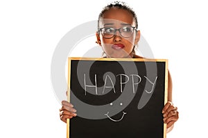 Unhappy dark skinned woman holding blackboard