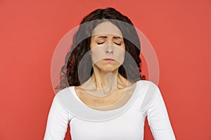 Unhappy depressed woman with closed eyes suffer from depression or pain. Upset millennial female