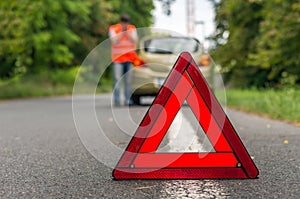 Unhappy driver and broken car on the road