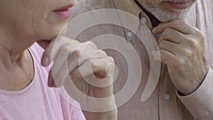 Unhappy elderly couple sitting and thinking about problems, feeling helpless