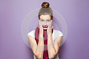 Unhappy emotional expression concept on purple background.