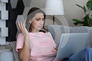 Unhappy ethnic woman frustrated with computer problems