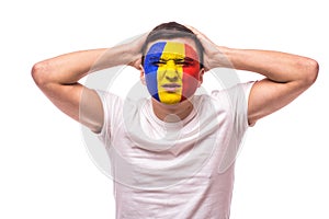 Unhappy and Failure of goal or lose game emotions of Romanian football fan in game supporting of Romania national team