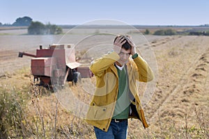 Unhappy farmer in soybean field