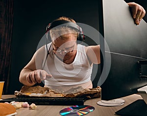 Unhappy fat man trying to fix the computer