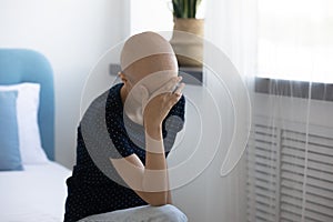 Unhappy female cancer patient feel depressed at home