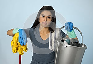 Unhappy and frustrated housekeeping woman holding mop and wash bucket as hotel cleaner service or house maid